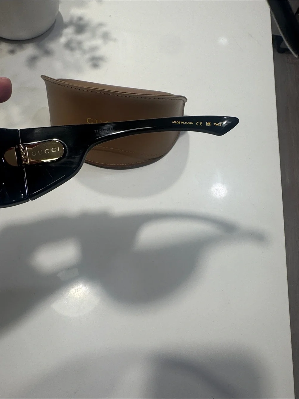 Gucci Black Shield Sunglasses with Gold GG Emblem